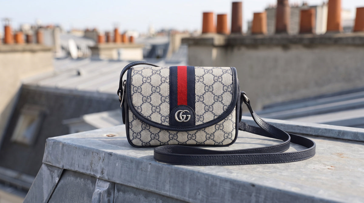 Authenticated pre-owned Gucci bag on a Paris rooftop ledge