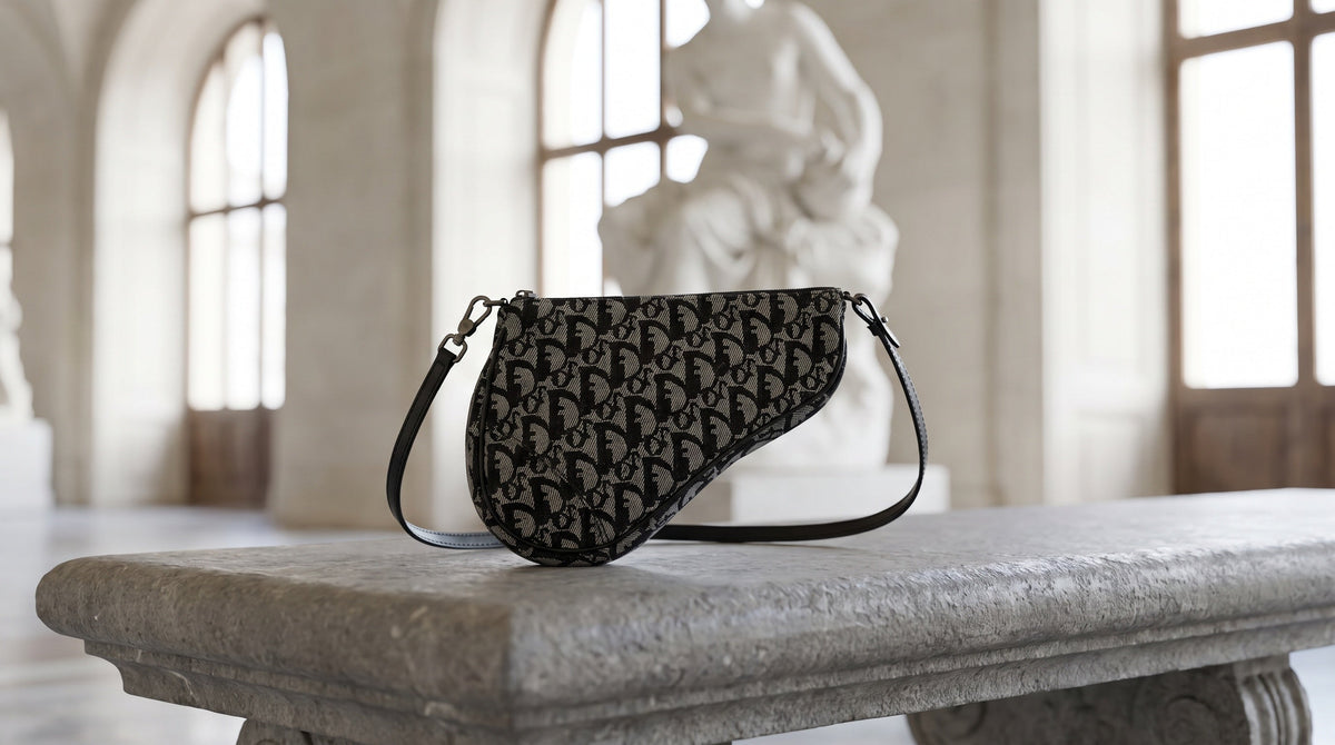 Authenticated pre-owned Galliano-era Dior Saddle bag on a museum bench