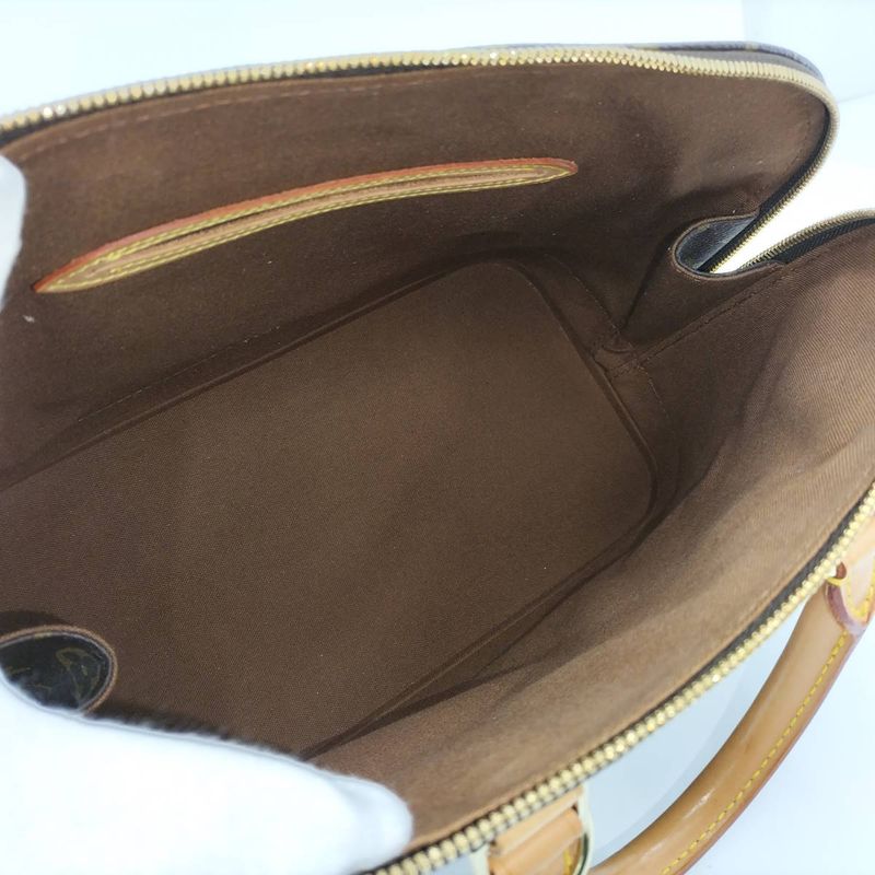 Louis Vuitton Alma Monogram Handbag — view 9