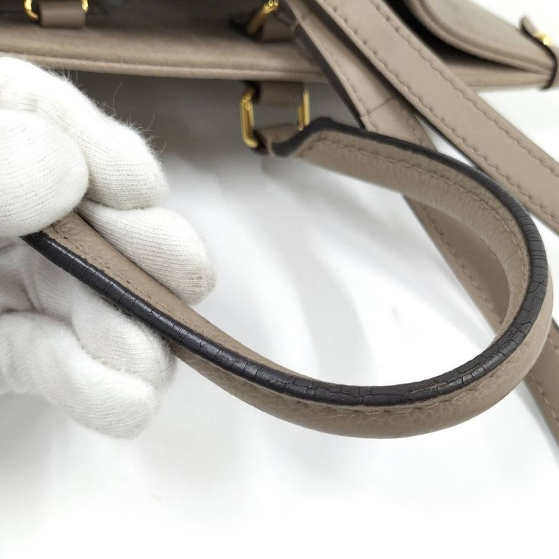 Louis Vuitton On The Go MM 2-Way Handbag Bicolor Monogram Empreinte Tourterelle