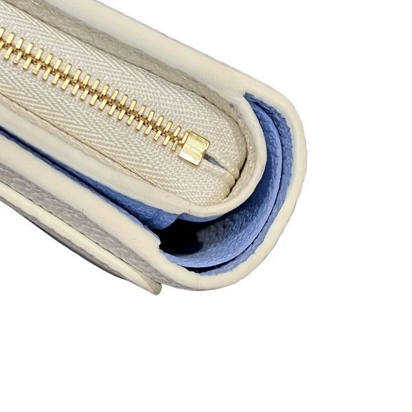Louis Vuitton Monogram Empreinte Portefeuille Clair Bifold Wallet — view 9