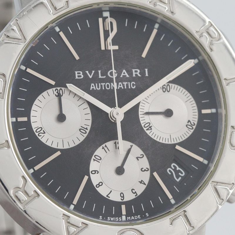 Bvlgari Chronograph at SS Bracelet Dial Color: Black.