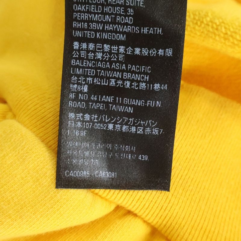 Balenciaga Distressed Logo Print Cotton Jersey Hoodie Yellow