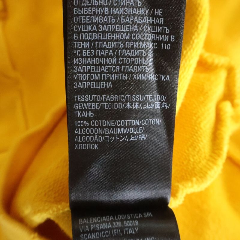 Balenciaga Distressed Logo Print Cotton Jersey Hoodie Yellow