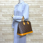 Louis Vuitton Alma Monogram Handbag Canvas Brown — view 2