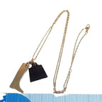Hermes Necklace Amulet Marokinier Gold Brown Metal Buffalo Horn Boots Motif