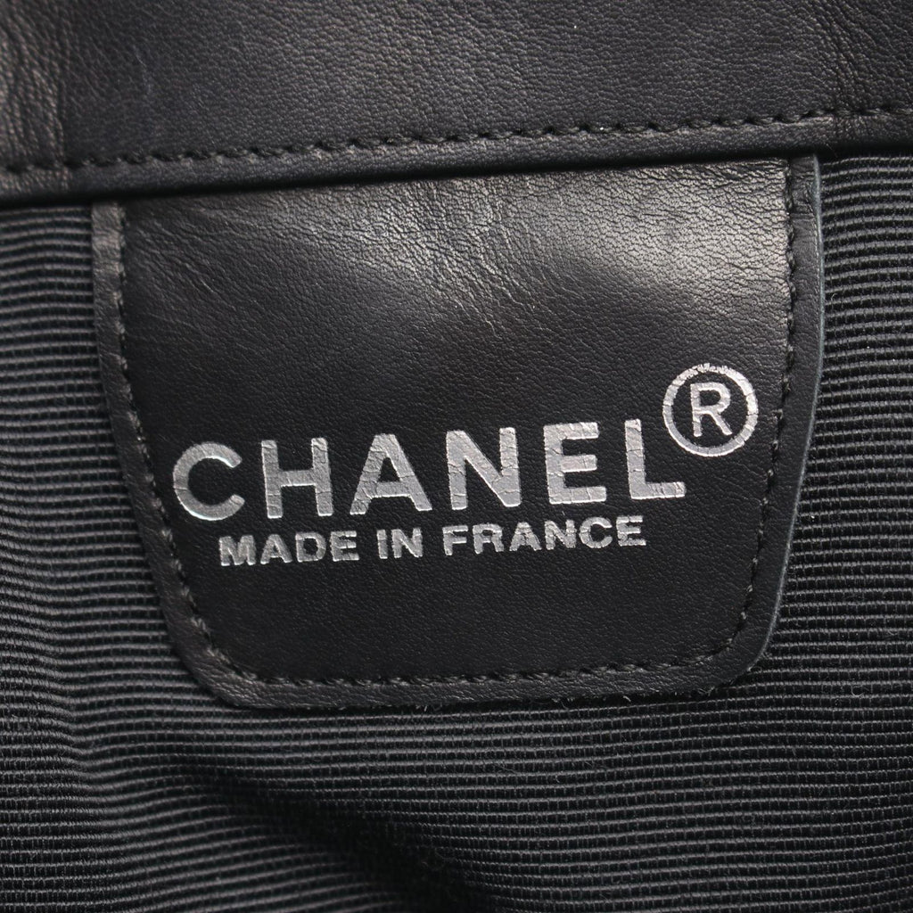 Chanel Shoulder Bag Embossed Logo Black Lambskin — view 4