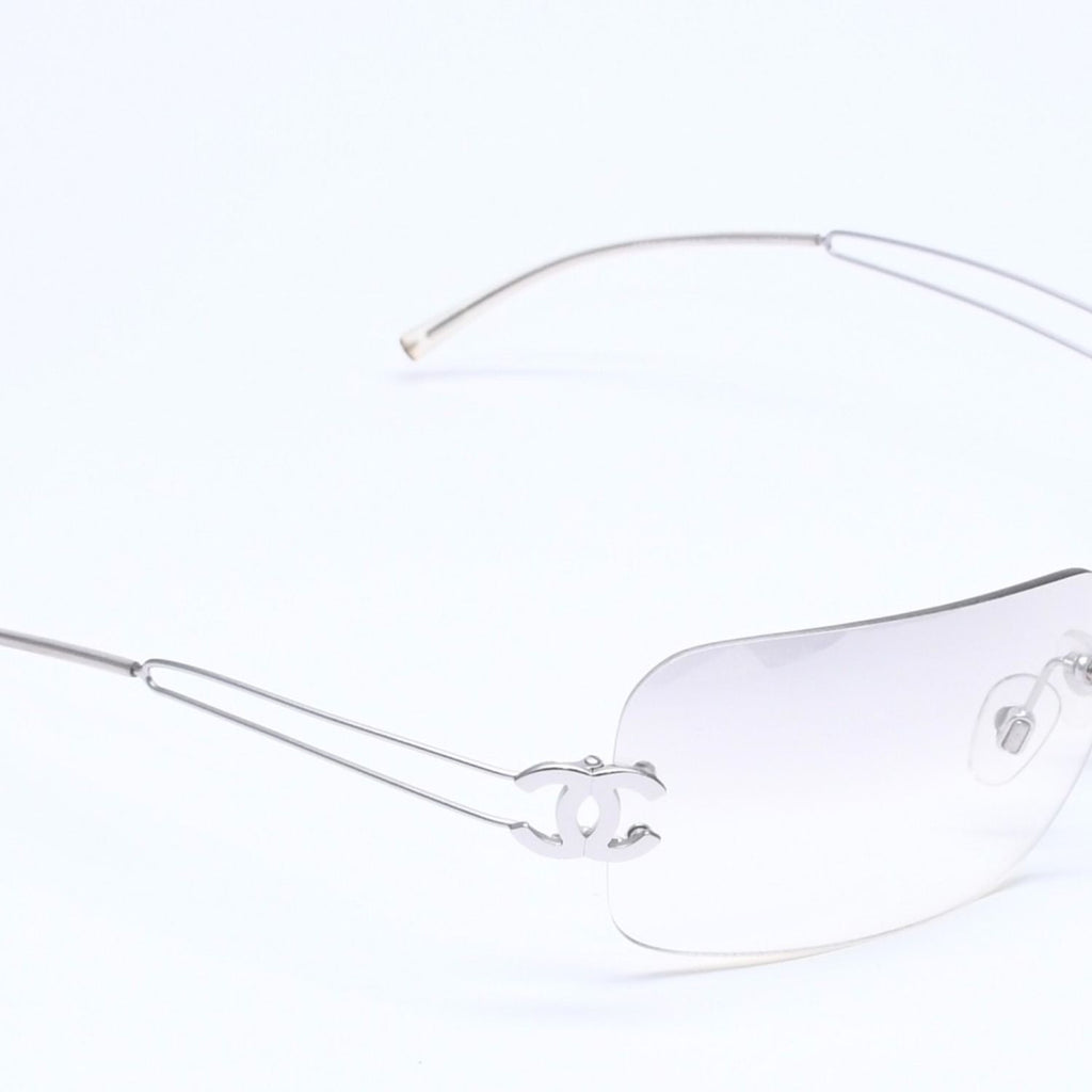 Chanel Rimless Sunglasses Side CC Logo Light Gray Gradient Silver Frame Eyewear — view 4