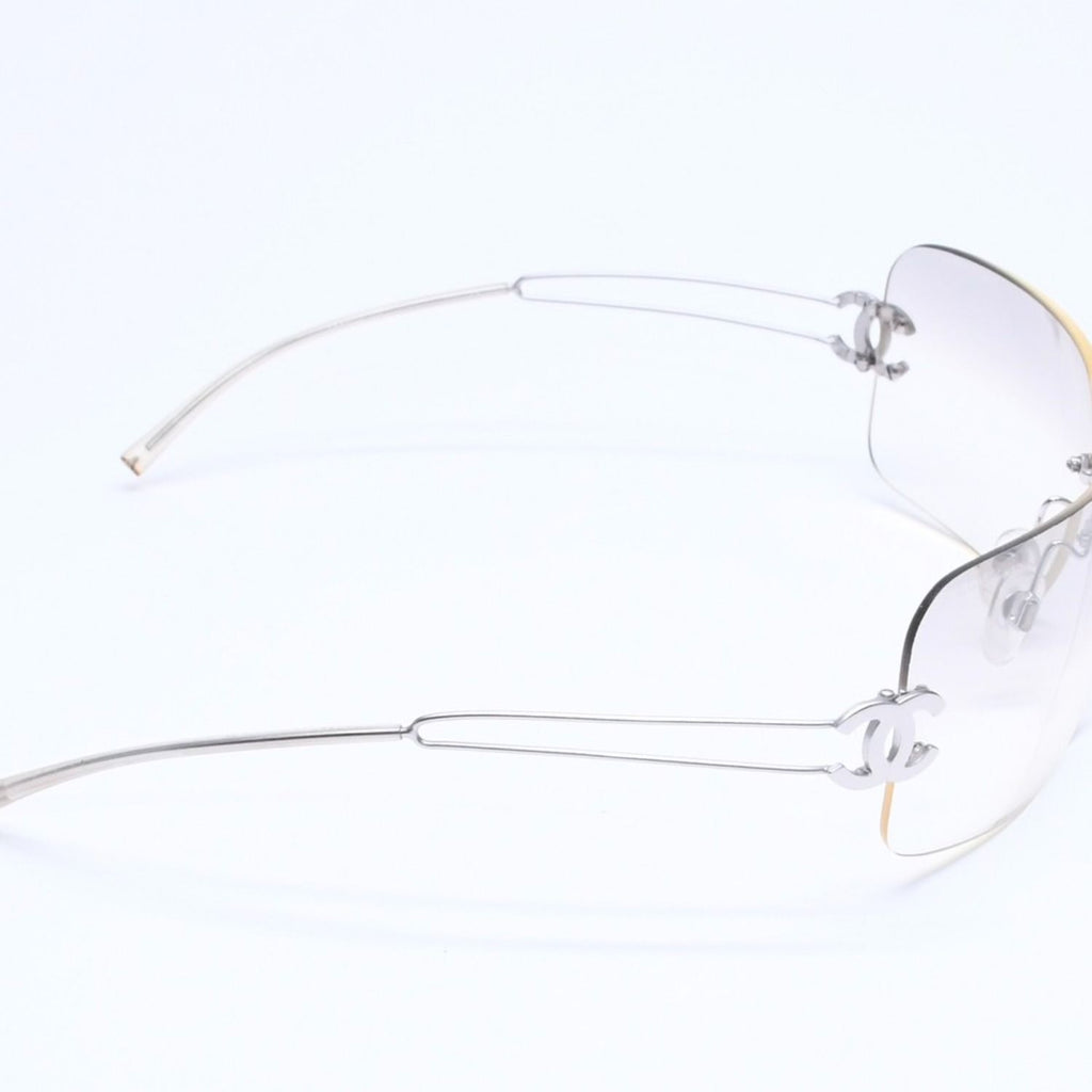 Chanel Rimless Sunglasses Side CC Logo Light Gray Gradient Silver Frame Eyewear — view 5