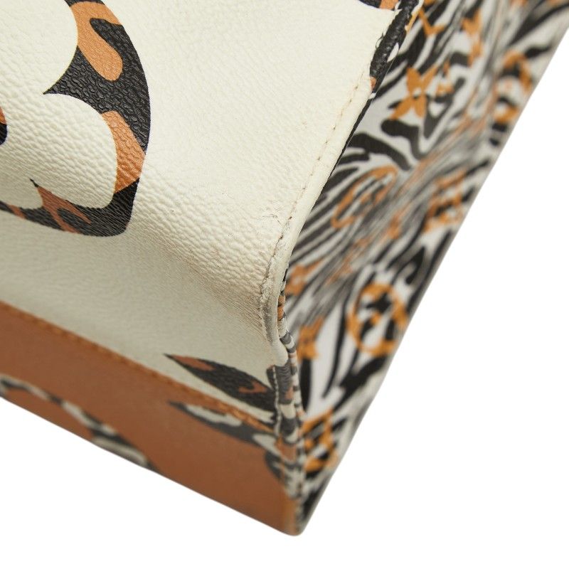 Louis Vuitton Monogram Jungle On The Go GM Tote Ivory Orange Leather — view 4