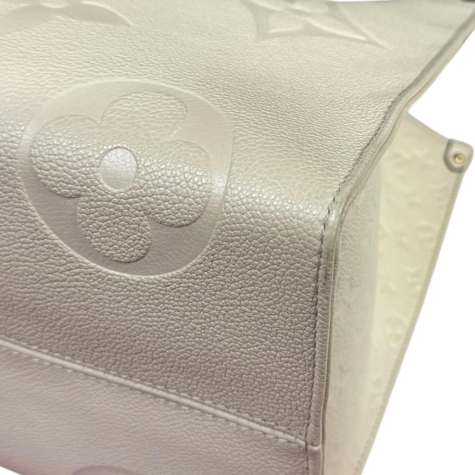 Louis Vuitton On The Go GM Monogram Empreinte Shoulder Bag Beige — view 8