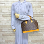 Louis Vuitton Alma Monogram Handbag Canvas Brown — view 2