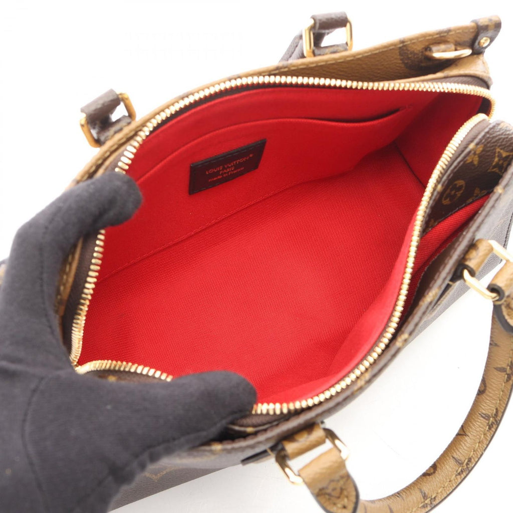 Louis Vuitton Handbag On The Go East West Chain Monogram Reverse 2-Way Canvas on — view 3