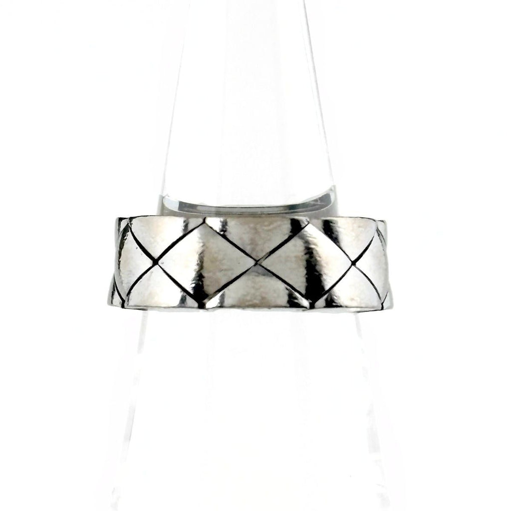 Chanel Quilted Ring Ation on the metal.