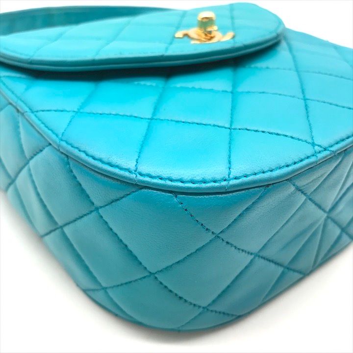 Chanel CC Logo Turnlock Quilted Lambskin Mini Hand Vanity Bag Blue — view 4