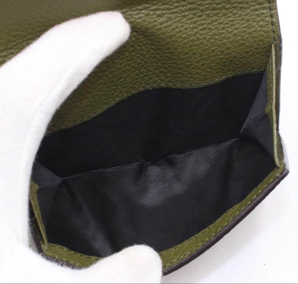 Gucci Embossed Logo Leather Trifold Wallet — view 7